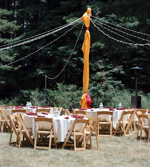 Dining tables and maypole light strings. -- 