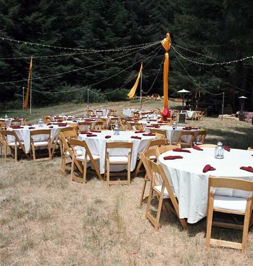 Dining tables and maypole light strings. -- 